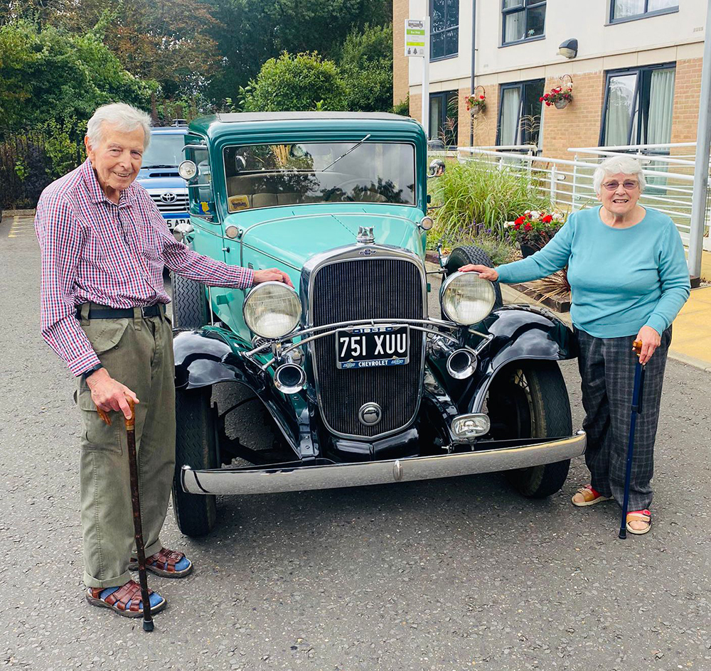 Care home residents admire vintage car